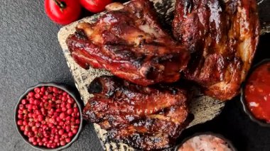 Grilled or barbecued pork ribs with sauce. Grilled ribs as a food background for your design.