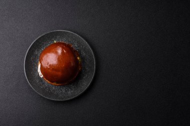 A burger, a hamburger with cheese, beef, and a bun, is unhealthy takeaway food. A burger or cheeseburger as a food background for your design.