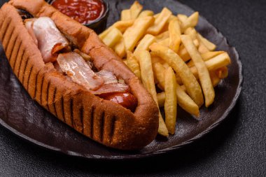 French fries are salty, crispy, and fried in oil, unhealthy takeaway food. French fries as a food backdrop for your design.