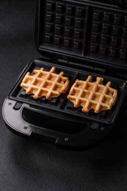 Belçika waffle 'ı, sağlıklı bir tatlı kahvaltı tatlısı, yemek geçmişi. Tasarımınız için gıda arka planı olarak Belçika waffleları
