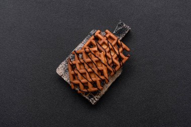 Belçika waffle 'ı, sağlıklı bir tatlı kahvaltı tatlısı, yemek geçmişi. Tasarımınız için gıda arka planı olarak Belçika waffleları