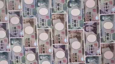 Japonya, Japon yeni kağıt banknotlar, iş için para, finansal işlemler ve anlaşmalar. Tasarımınız için finansal bir arkaplan olarak Japonca yen