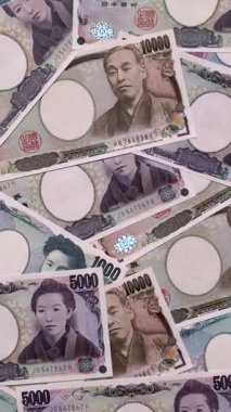 Japonya, Japon yeni kağıt banknotlar, iş için para, finansal işlemler ve anlaşmalar. Tasarımınız için finansal bir arkaplan olarak Japonca yen