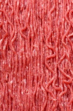 Hamburger için çiğ et ya da domuz eti ya da tuzlu ve baharatlı köfte. Tasarımınız için yemek arkaplanı olarak çiğ et.