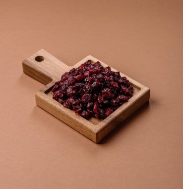 Dried sweet cranberries, natural berries for a healthy diet. Dried cranberries as a food background for your design