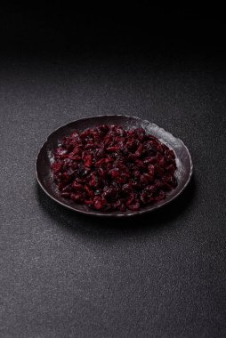 Dried sweet cranberries, natural berries for a healthy diet. Dried cranberries as a food background for your design