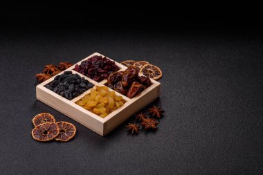 Dried fruits and berries, cranberries, dates, and raisins for a healthy diet. Dried berries and fruits as a food background for your design