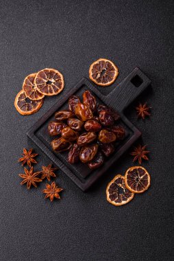 Dried sweet dates, natural tropical fruits for a healthy diet. Dried dates as a food background for your design