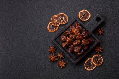 Dried sweet dates, natural tropical fruits for a healthy diet. Dried dates as a food background for your design