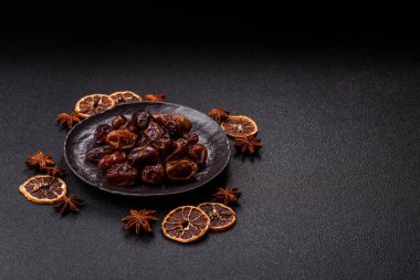 Dried sweet dates, natural tropical fruits for a healthy diet. Dried dates as a food background for your design