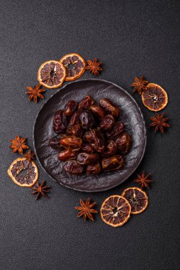 Dried sweet dates, natural tropical fruits for a healthy diet. Dried dates as a food background for your design