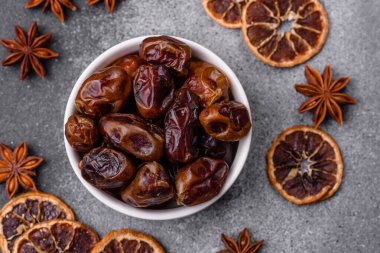 Dried sweet dates, natural tropical fruits for a healthy diet. Dried dates as a food background for your design