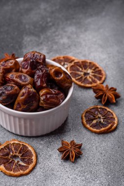 Dried sweet dates, natural tropical fruits for a healthy diet. Dried dates as a food background for your design