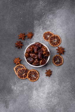 Dried sweet dates, natural tropical fruits for a healthy diet. Dried dates as a food background for your design