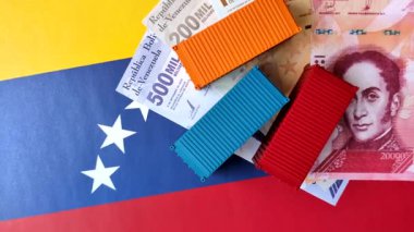 Venezuela bayrağındaki kargo konteynerleri mal ihracatı ve lojistik için kavramsal bir zemin olarak kullanılıyor. Tasarımınız için arka plan olarak Venezuela bayrağında bulunan kargo konteynerleri