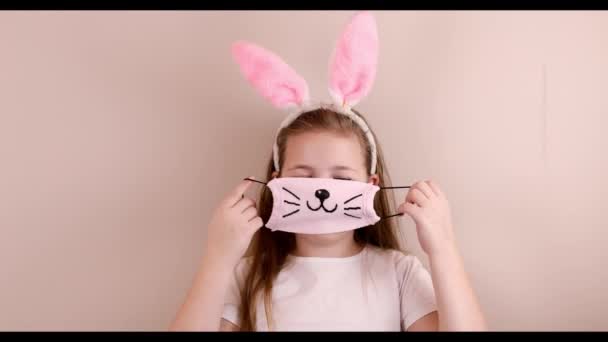 Girl Rabbit Ears Her Head Having Fun Putting Protective Mask — Stock Video