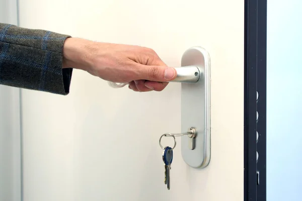 Man Holding White Door Handle Ajar Door Keys Lock — Stock Photo, Image
