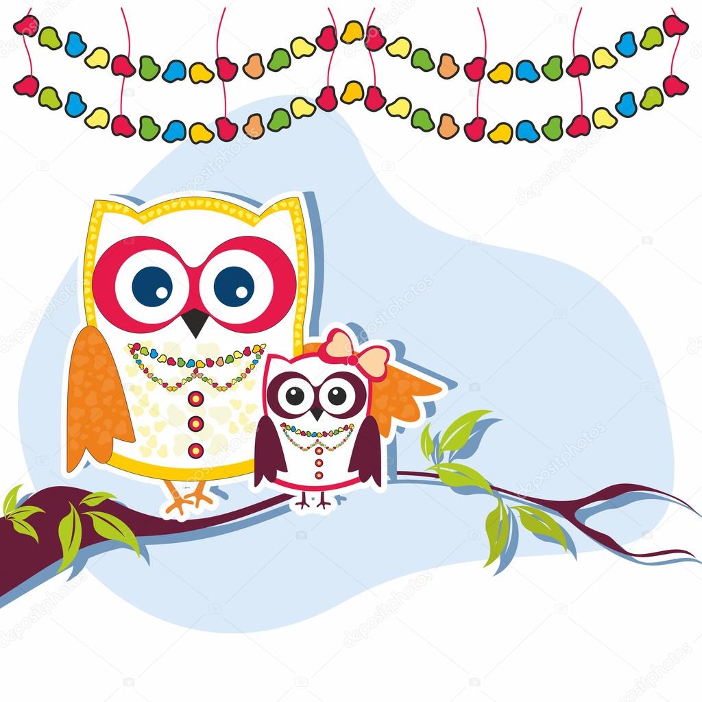 Holiday owls on a branch