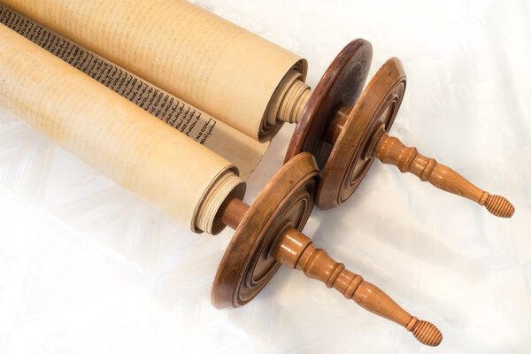 The Hebrew handwritten Torah scroll, on a synagogue alter, illustrating Jewish holidays, during fests. Closed version