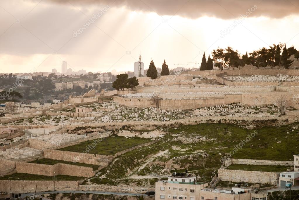 Panorama of Jerusalem from the Mount of Olives, with cloud in the sky and beautiful rays of sun