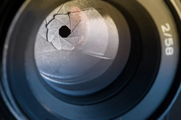 Camera diaphragm aperture with flare and reflection on lens — Stock Photo, Image