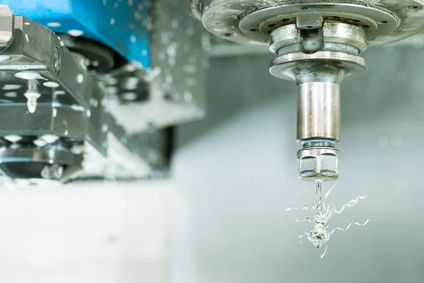 Side view on CNC milling machine drill with metal shaving scrap on it — Stock Photo, Image