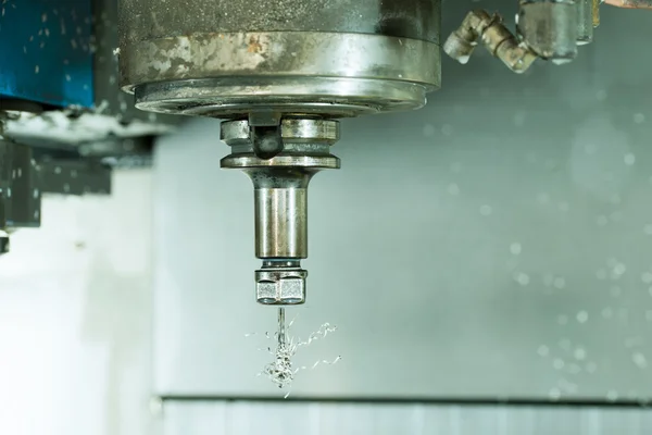 Side view on CNC milling machine drill with metal shaving scrap on it — Stock Photo, Image