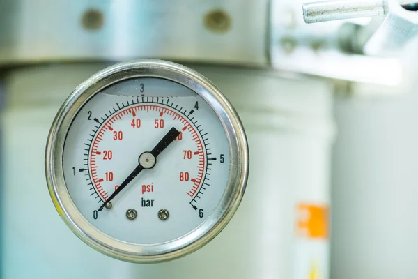 Manometer turbo pressure meter gauge in pipes oil plant with liquid inside — Stock Photo, Image