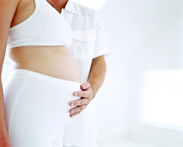Kobieta w ciąży na białym tle Zdjęcie Stockowe