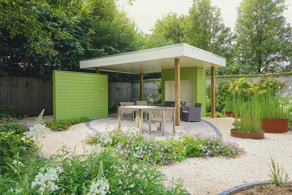 Garden with terrace and overhang, decorated with trendy garden f