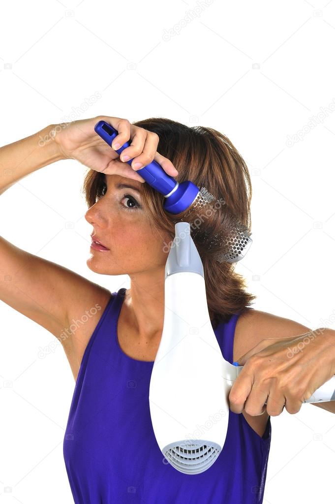 Woman blow drying hair