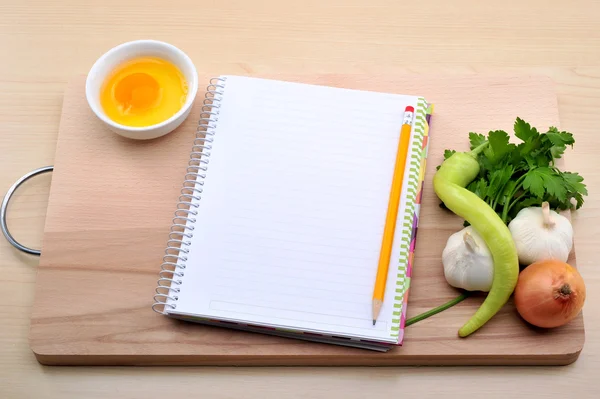 Blank recipe book with garlic, onion, parsley, egg — Stock Photo, Image
