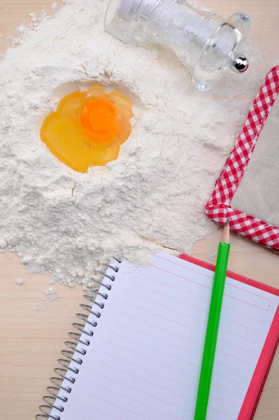 Blank recipe book with egg, flour — Stock Photo, Image