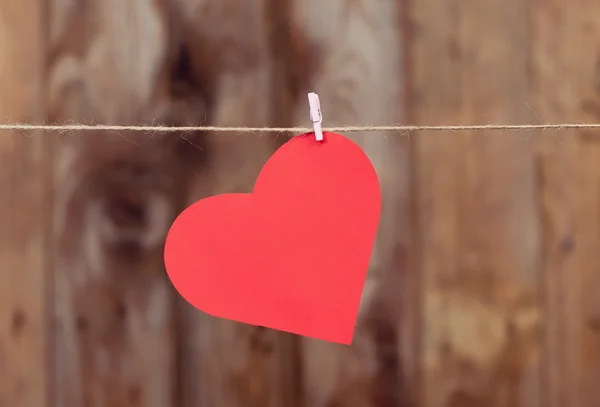 Heart made of paper hanging on a rope — Stock Photo, Image