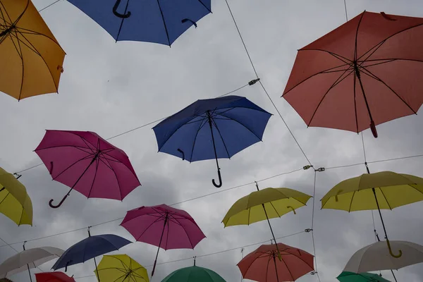 Many colourful umbrellas flying in the sky — Stock Image Many Colourful Umbrellas Flying Sky Stock Photo