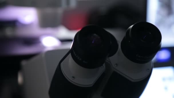 Inserting sample in modern microscope closeup binoculars — Stock Video