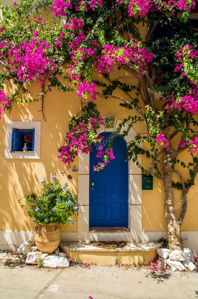 traditional greek house with flowers in assos, kefalonia island traditional greek house with flowers in assos, kefalonia island