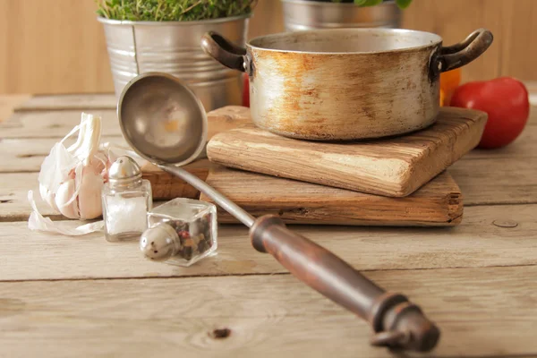 Tomato soup with basil in a pot on the marble — Stock Photo, Image