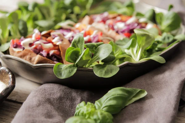 Baked sweet potatoes in the oven with carrots and cabbage — Stock Photo, Image