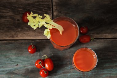 Cocktail bar. Bloody Mary with tomatoes and celery clipart