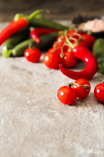 small zucchini with tomatoes and chili salt