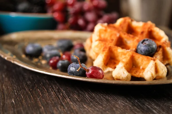 Belgian waffles with fresh berries and grapes on rustic wooden b — Stock Photo, Image