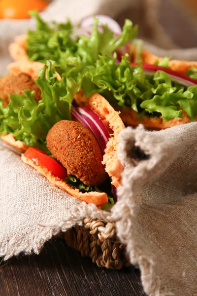 Doner kebab - falafel fresh vegetables in pita Brad on wooden ta — Stock Photo, Image
