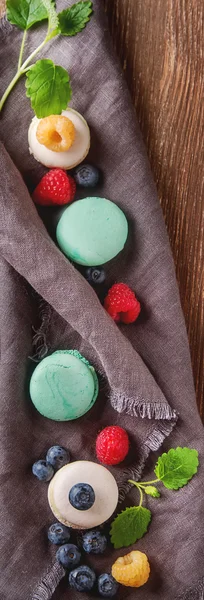 Traditional French sweets. Assorted colorful macaroons with mint — Stock Photo, Image