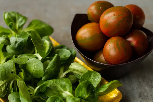 Diet for girls. lettuce and tomato on a platter — Stock Image Diet for girls. lettuce and tomato on a platter Royalty Free Stock Images