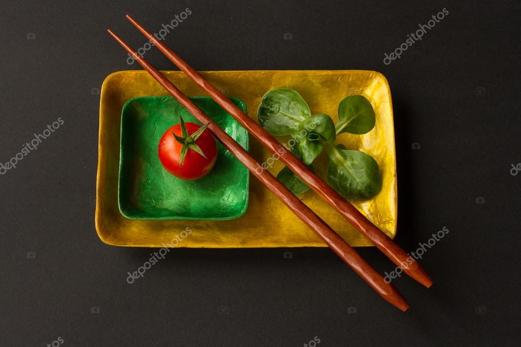 Diet for girls. lettuce and tomato on a platter