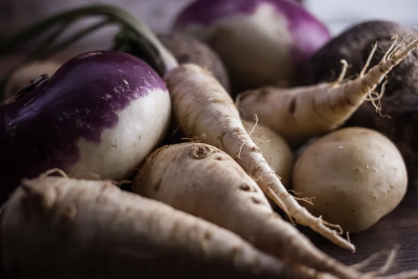 root vegetables from the garden on a brown background