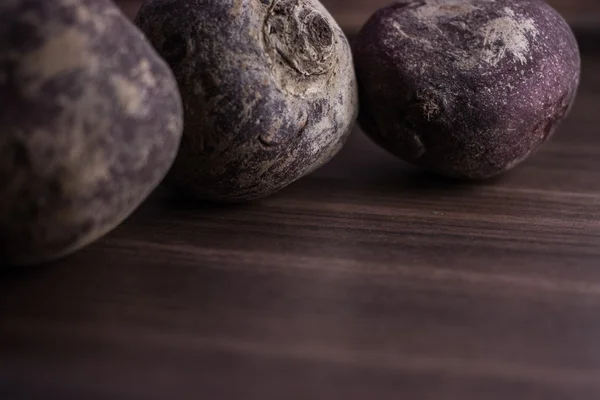 Root vegetables from the garden on a brown background — Stock Photo, Image