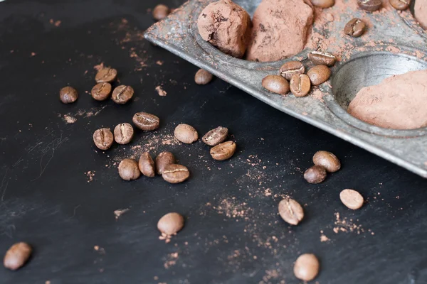 Chocolate truffles in an unusual shape with metal cutlery — Stock Photo, Image