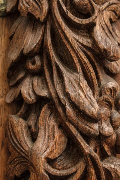 Carved brown wood. interesting work of the old masters — Stock Photo, Image